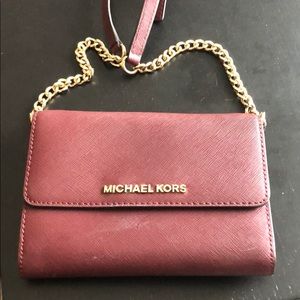 Burgundy Michael Kors crossbody bag